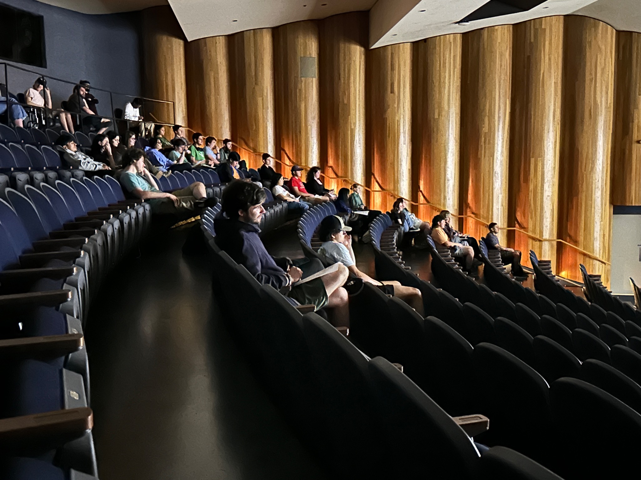 Audience members watching a 2024 festival screening in the UHCL Bayou Theater