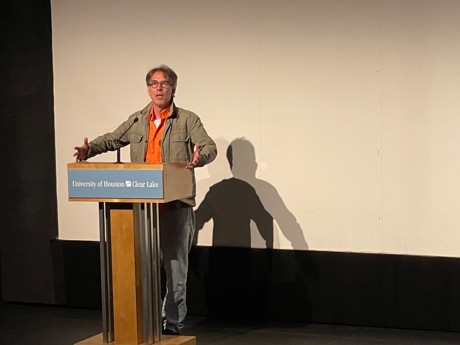 Speaker at a UHCL lectern during the festival